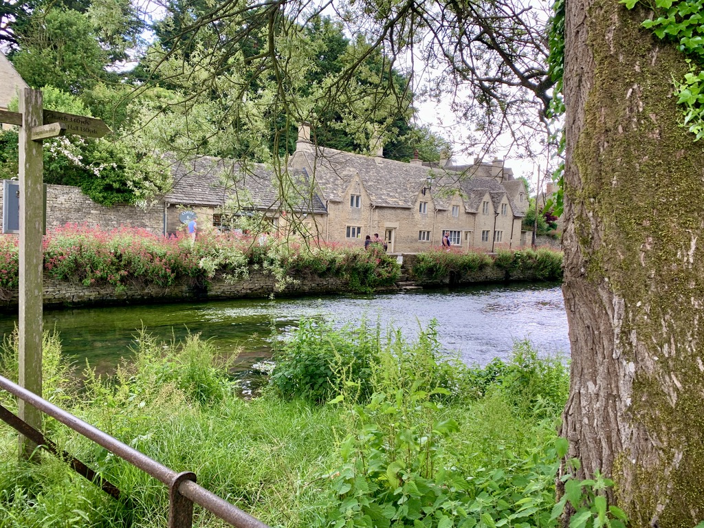 The beautiful town of Bibury, England as seen from accross the river