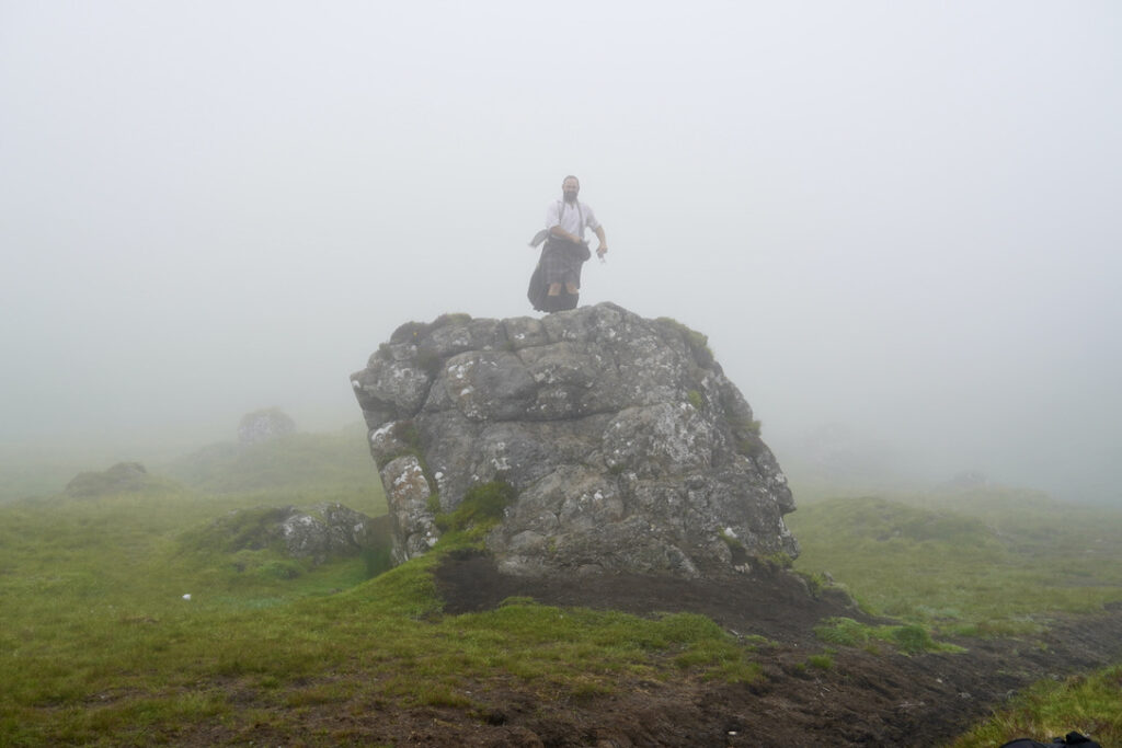 Our tourguide, Andy the Highlander, scaled a large boulder in his full Scottish Tartan