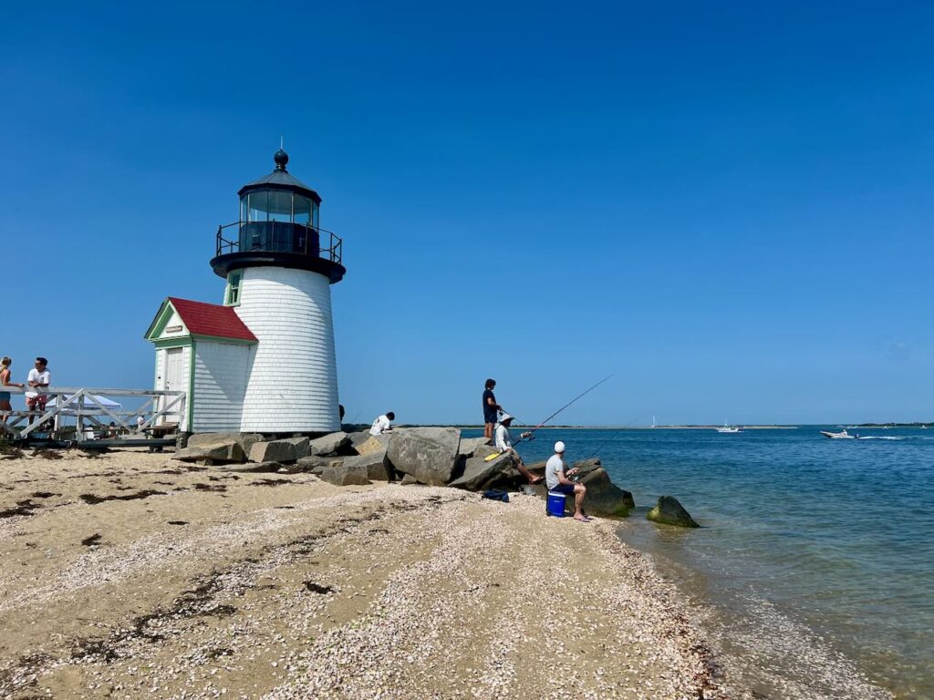 White lighthouse on a beach in New England.